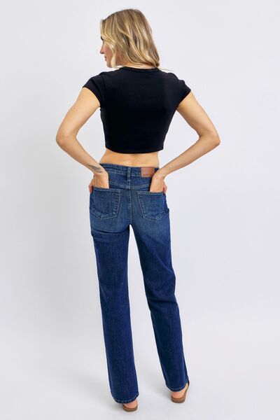 Woman showcasing Judy Blue plus size tummy control straight jeans from the back, highlighting style and comfort for everyday wear.