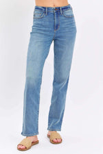 Woman wearing Judy Blue High Waist Straight Jeans with a flattering silhouette and classic straight leg cut