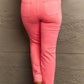 Back view of model wearing Kenya High Waist Side Twill Straight Jeans in pink, showcasing flattering fit and elegant side detailing. Risen Jeans