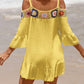 Woman wearing yellow crochet cold shoulder three-quarter sleeve cover-up with ruffled hem at the beach.