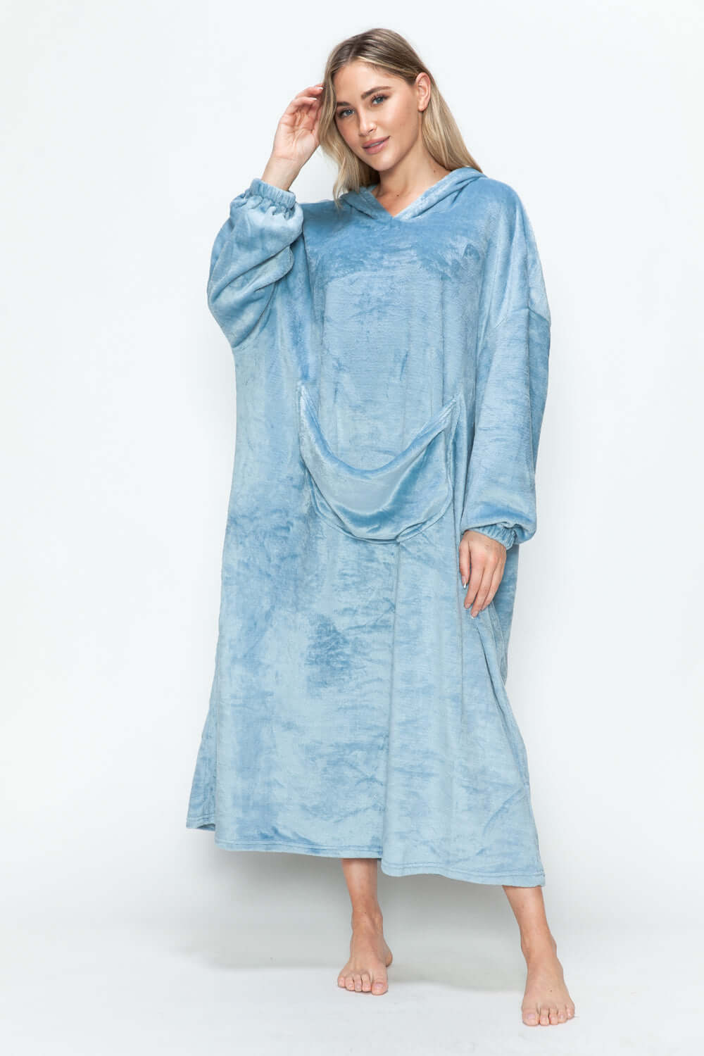 Woman modeling a cozy blue hooded midi lounge dress with pockets, perfect for chilly fall days.