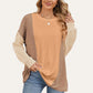 Woman wearing Double Take Texture Contrast Round Neck Long Sleeve T-Shirt in trendy color combo, perfect for stylish layering.