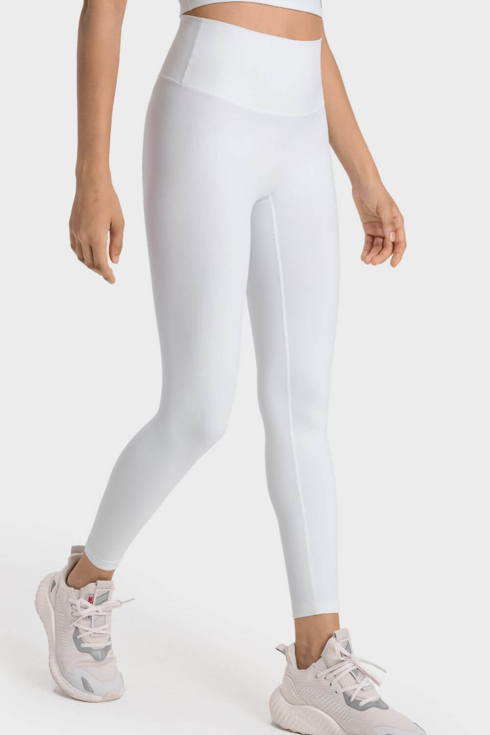 Millennia High-Rise Wide Waistband Yoga Leggings in white, designed for comfort and style during yoga practice.