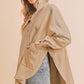 Stylish Aemi+Co Slit Half Snap Oversize Hoodie in beige, featuring a split design and casual yet chic vibe.