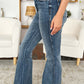 High Waist Tummy Control Flare Jeans by Judy Blue Jeans, side view showing sleek silhouette and retro flare leg in casual indoor setting