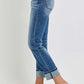 High-rise cropped straight roll-up jeans, versatile for any occasion, shown with rolled hem on model, side profile view.