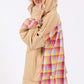 Woman in beige mineral wash hoodie with plaid print hood and back side, showing contrast multi-plaid design and relaxed fit.