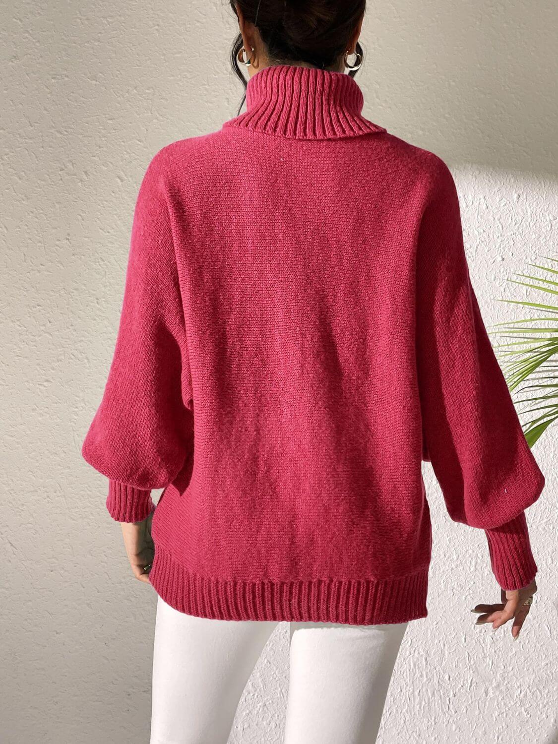 Woman wearing Bella Road Lip Turtleneck Long Sleeve Sweater in bold pink, showcasing relaxed fit and moderate stretch material.