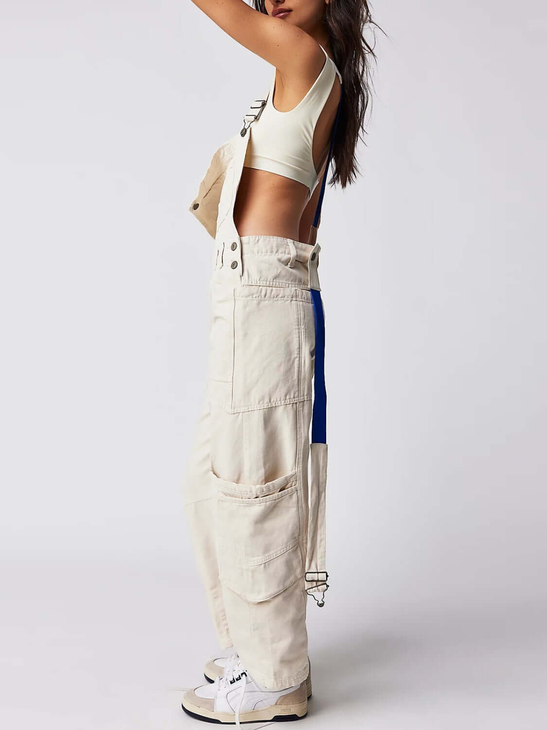 Ivory Bella Road Denim Overalls with Wide Straps and Pockets, Styled for Adventure and Fashion in a Trendy Look.