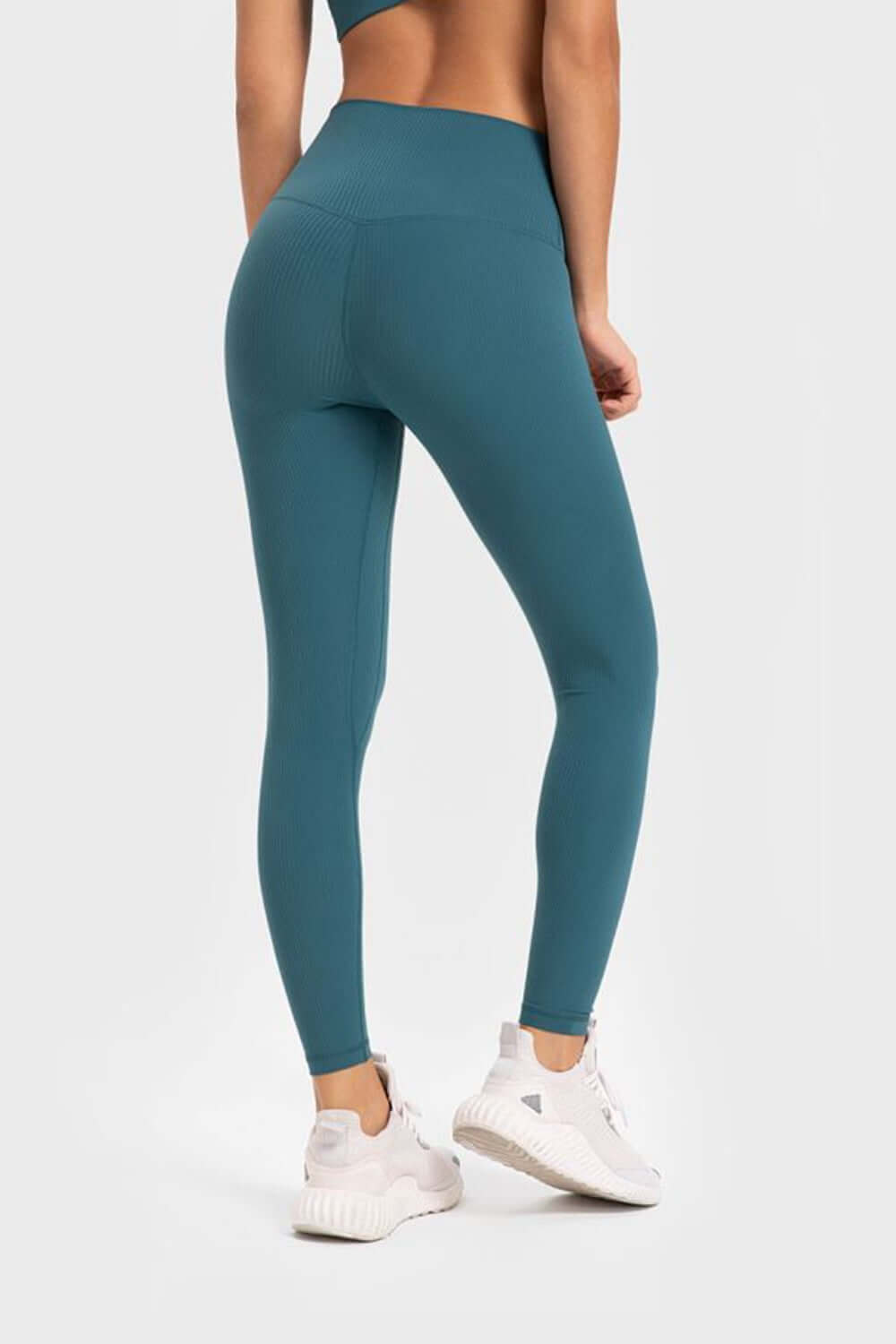 Millennia highly stretchy yoga leggings with wide waistband in teal, showcasing comfort and flexibility. Perfect for workouts!