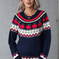 Model wearing angel wings sweater with apple graphic, round neck, and long sleeves, perfect for a quirky, whimsical style.