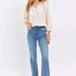 Woman wearing High Waist Straight Judy Blue Jeans with a white blouse, showcasing a versatile and on-trend casual outfit.