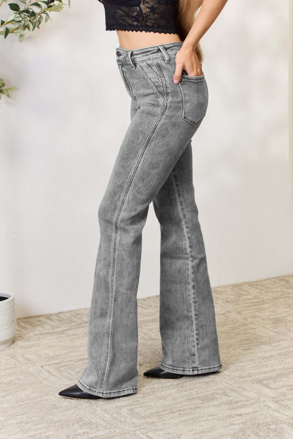 High Waist Slim Flare Jeans elongating legs with a flattering silhouette, styled with a lace top for a chic and polished look.