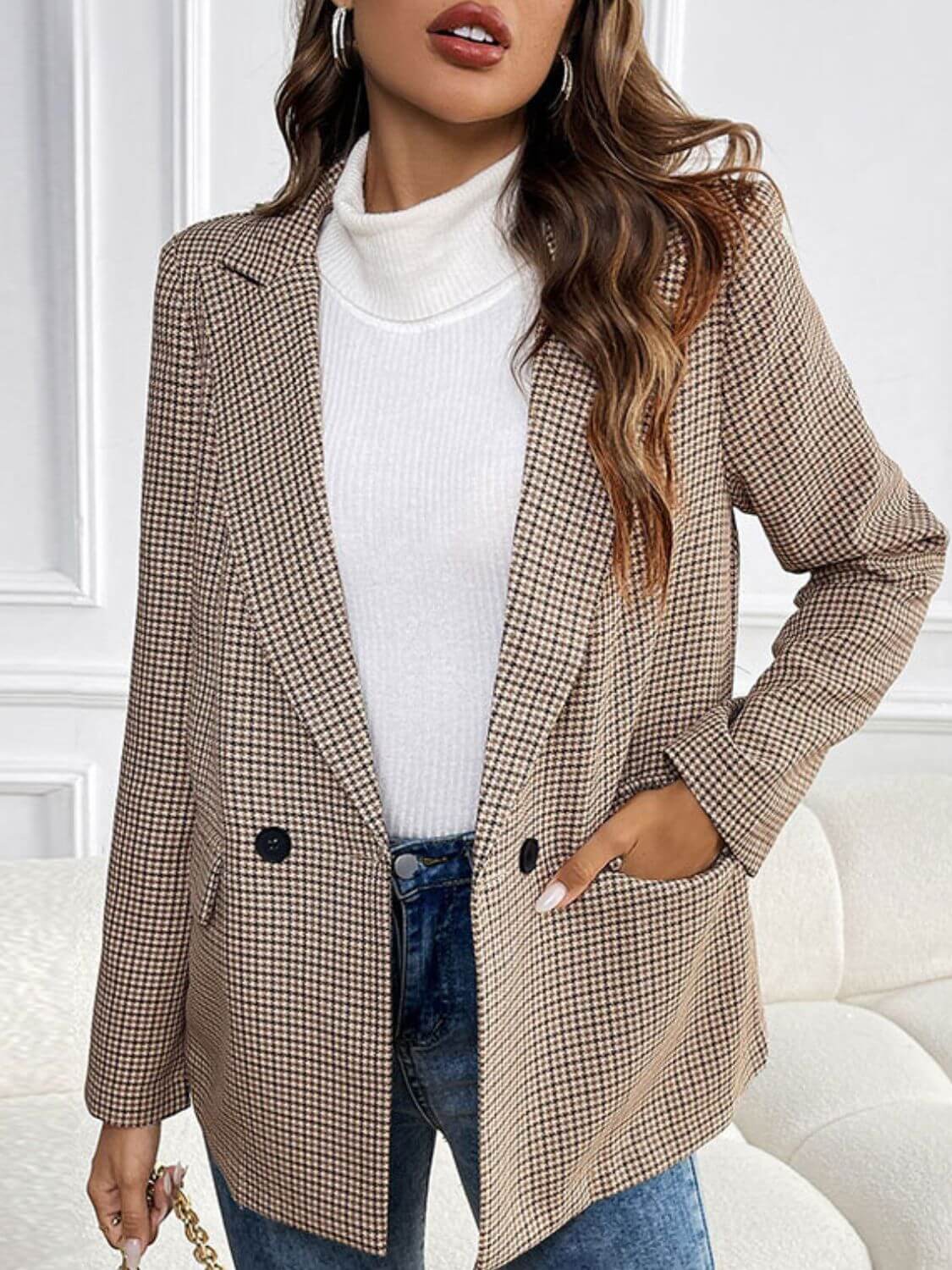 Woman wearing Perfee Plaid Lapel Collar Long Sleeve Blazer with buttoned front and pockets, paired with a white turtleneck and blue jeans.