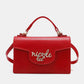 Nicole Lee USA small red crossbody wallet handbag with removable and adjustable strap, made from vegan leather.