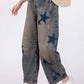 Model wearing SAGE + FIG Star Wide Leg Jeans with Pockets, featuring a chic star pattern and comfy fit.