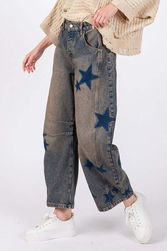 Model wearing SAGE + FIG Star Wide Leg Jeans with Pockets, featuring a chic star pattern and comfy fit.