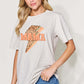 Woman wearing a MAMA Round Neck Short Sleeve T-Shirt with graphic design, paired with blue jeans