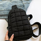 Black Bella Road Quilted Nylon Crossbody Bag styled with denim, showcasing trendy and durable design for any adventure.