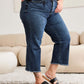 Woman wearing Tummy Control High Waist Raw Hem Jeans | Petite, RFM Jeans, showcasing distressed denim with trendy raw hem detailing.