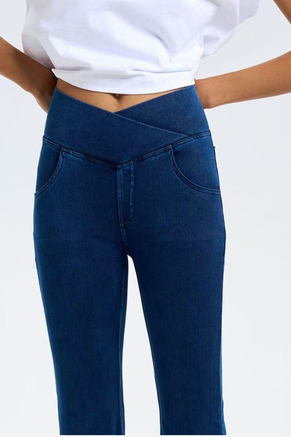 Basic Bae highly stretchy bootcut jeans with stylish cross-waist design and convenient pockets for everyday comfort.