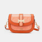 Nicole Lee USA croc-embossed crossbody bag in orange with adjustable strap and gold accents