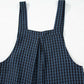 Stylish close-up of Bella Road Plaid Wide Strap Overalls in black and blue plaid, perfect for a trendy and comfy outfit.