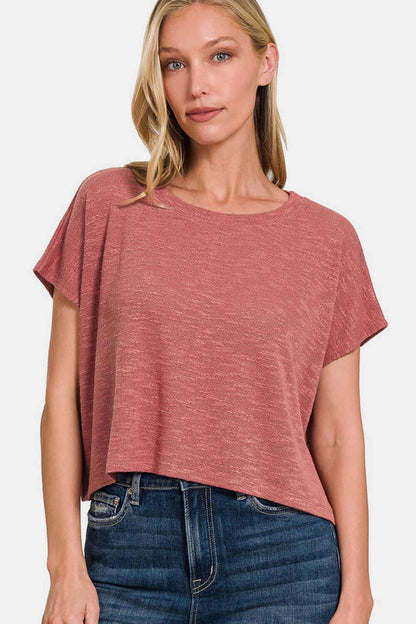 Woman wearing a Round Neck Short Sleeve T-Shirt with a classic, minimalist design in a casual, comfortable style paired with jeans.