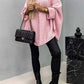 "Bella Road pink batwing sleeve sweater, styled with black leather pants and a chic handbag"