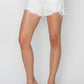 Chic button fly frayed hem denim shorts by Risen Jeans, perfect for summer styling with clear heels and trendy comfort.