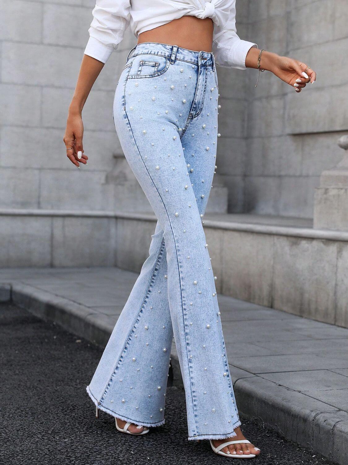 Woman wearing Bella Road Denim Pearl Trim Bootcut Jeans with Pockets, showcasing light wash and stylish pearl details.