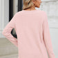 Woman wearing Bella Road waffle-knit notched long sleeve t-shirt in light pink, back view, standing outdoors with jeans.