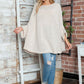 Cozy Bella Road batwing sleeve sweater with round neck, paired with ripped jeans and sneakers, perfect for casual style.