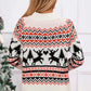 Woman wearing a cozy sweater with reindeer and angel wing design near a festive Christmas tree, perfect for holiday cheer.