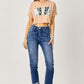 Woman wearing Risen Jeans High-Rise Frayed Cuffed Straight Jeans paired with a crop top and sandals.