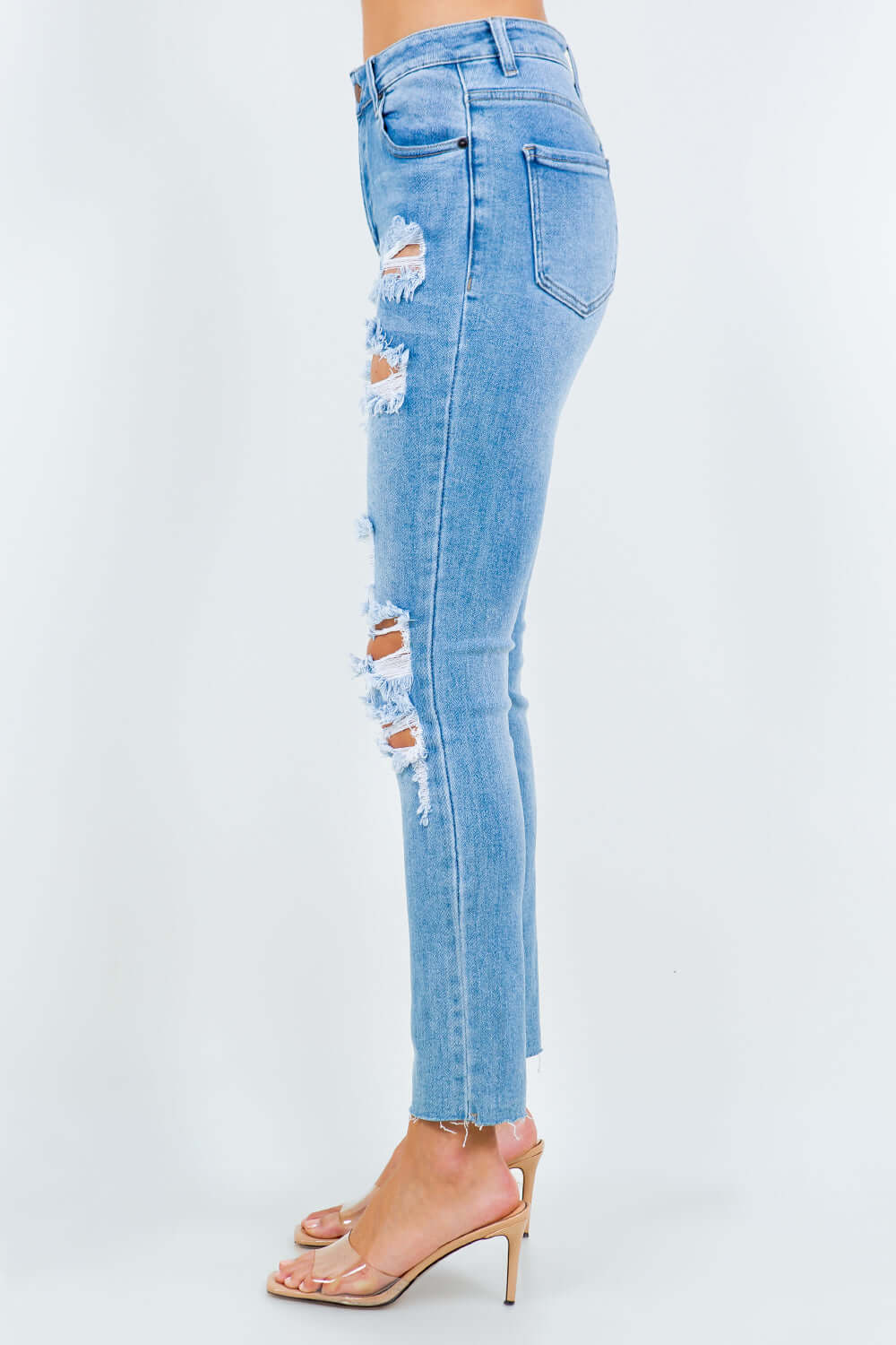 High waist destroyed jeans with distressed detailing and a flattering fit. Perfect for adding edgy style to any outfit.