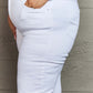 Close-up of woman wearing Raelene High Waist Wide Leg Jeans in White by Risen Jeans, showcasing flattering fit and comfortable high-rise design.