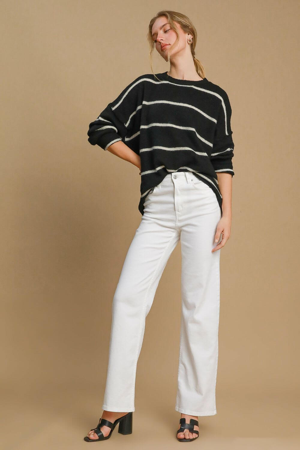 Cozy Umgee wool blend striped round neck sweater styled with white jeans and heels, perfect for casual or dressy occasions.