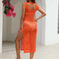 Woman wearing a sleeveless orange cutout openwork cover-up with round neck, featuring a slit, slightly stretchy sheer polyester material.