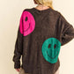 Oversize sweater with playful pink and green smiley faces, perfect for a cozy and trendy casual look.