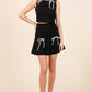 GEEGEE 2-Bow Pleated Mini Skirt at Bella Road