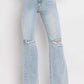 90's Vintage Super High Rise Flare Jeans with distressed details and wide flare legs, offering a retro-inspired and stylish silhouette