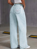 Back view of Bella Road wide leg denim jeans with bow detail and pockets in light wash, perfect for casual style.