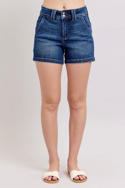 Judy Blue plus size double button waistband denim shorts in stylish dark blue wash, showcasing a flattering high-waisted fit.