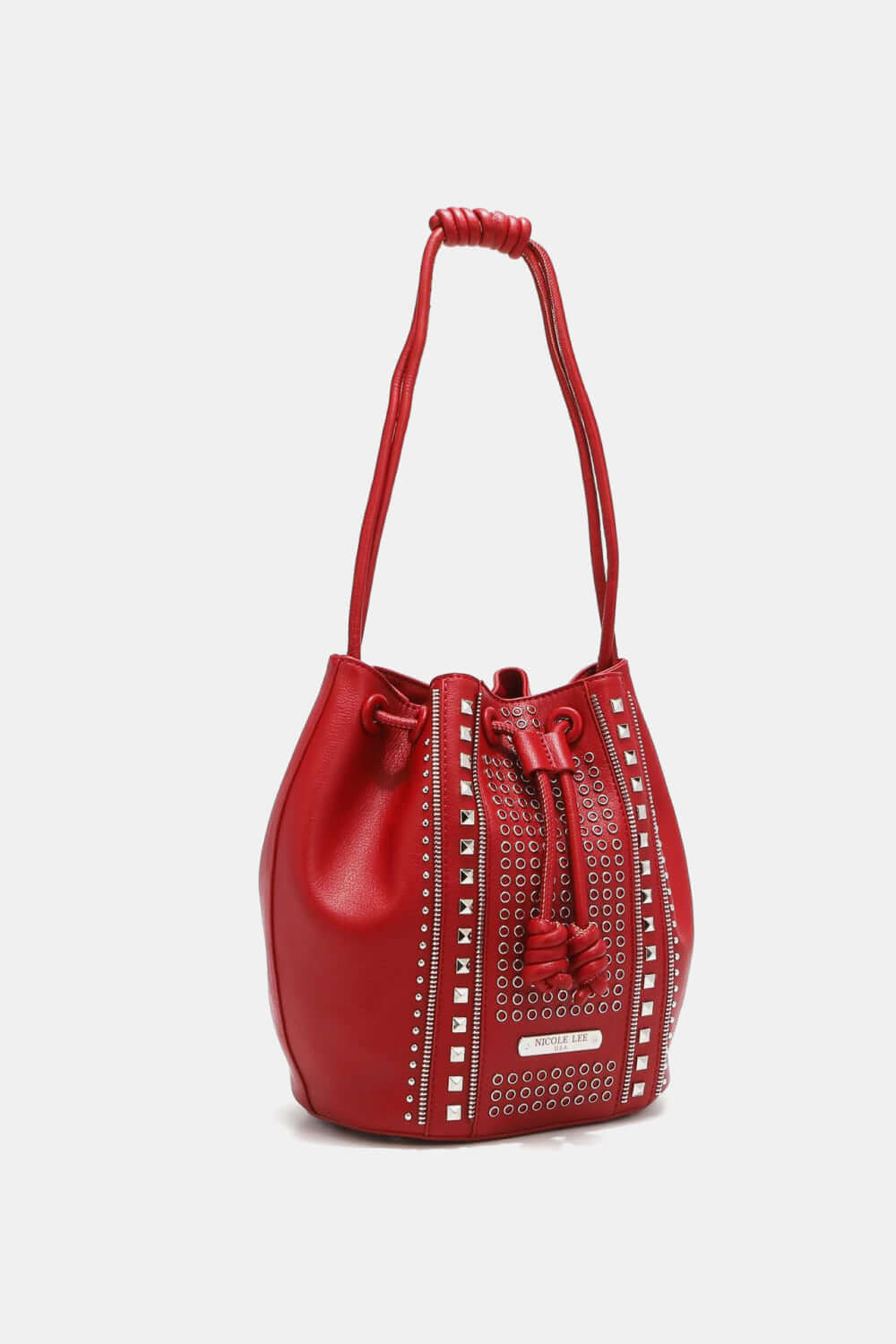 Nicole Lee USA Amy Studded Bucket Bag in red pebbled vegan leather with stud and zipper detailing, drawstring closure, and metal feet.