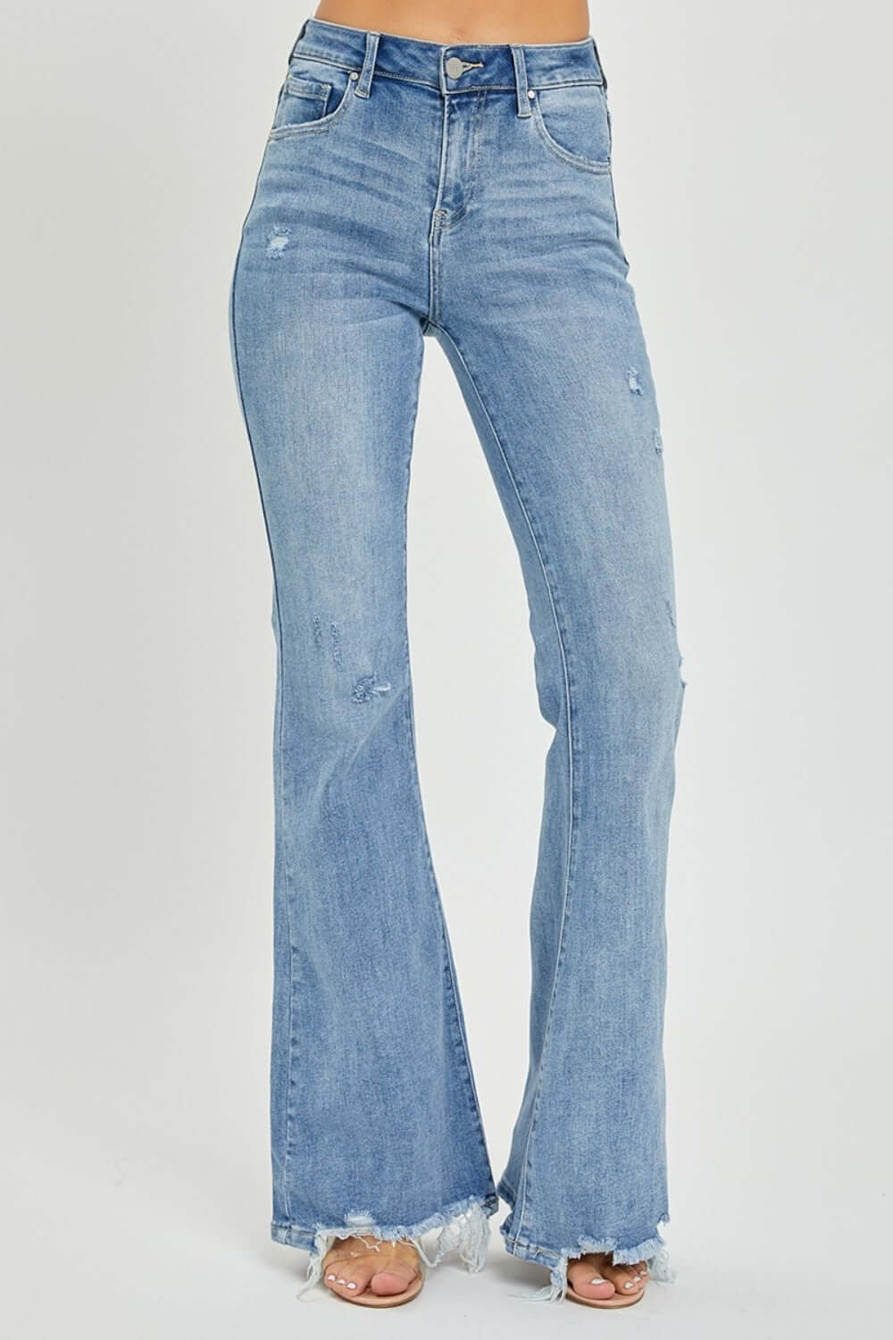 High Rise Frayed Hem Flare Jeans by Risen Jeans showcasing high-rise waist and flare leg with trendy frayed hem.