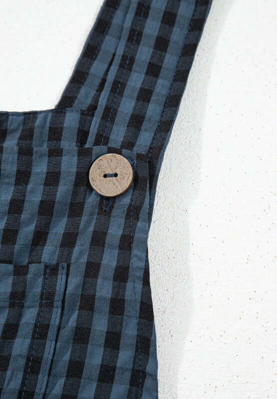 Bella Road plaid overalls showing wide strap detail with stylish button design for a trendy, comfortable look.