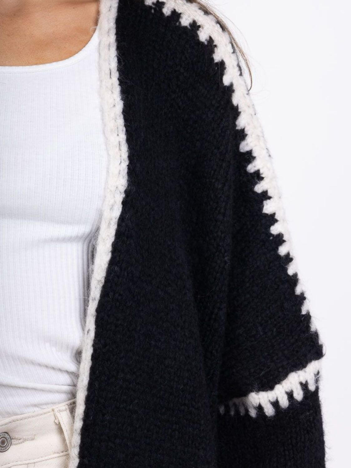 Close-up of Double Take Contrast Open Front Cardigan showcasing black and white pattern and dropped shoulder design.