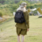 Stylish woman wearing Himawari waterproof anti-theft nylon backpack in nature setting