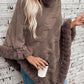 Cozy Bella Road Fuzzy Hem Cable-Knit Poncho in brown, perfect for chilly days, stylishly paired with a coffee cup.